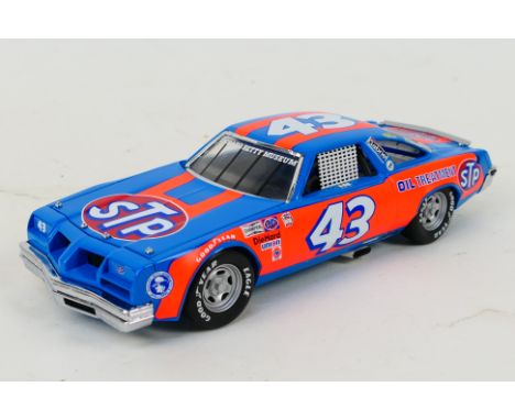 Franklin Mint - A 1979 Richard Petty Oldsmobile 442 in 1:24 scale. The model appears Mint in its original polystyrene packagi