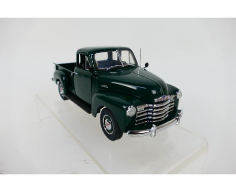 Franklin Mint - A boxed 1953 Chevrolet Pickup in 1:24 scale. The model appears Mint in its original packaging. (This does not