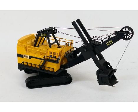 Conrad - An unboxed 1:87 scale Conrad #294 P&amp;H 2800 Face Shovel Excavator. The model has a loose string, and a couple of 