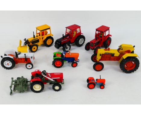 Britains - Milton - Yonezawa - Tomica - An interesting collection of eight unboxed diecast model tractors in various scales. 
