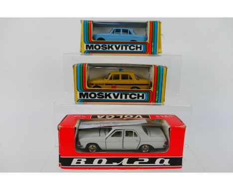 Russian Diecast - 3 x boxed models in 1:43 scale, Moskvitch 412 Police car, Gaz 3102 Volga saloon and a Moskvitch 412 saloon 