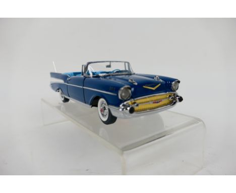 Franklin Mint - A boxed 1957 Chevrolet Bel Air Convertible in 1:24 scale. The model appears Mint in its original packaging. (