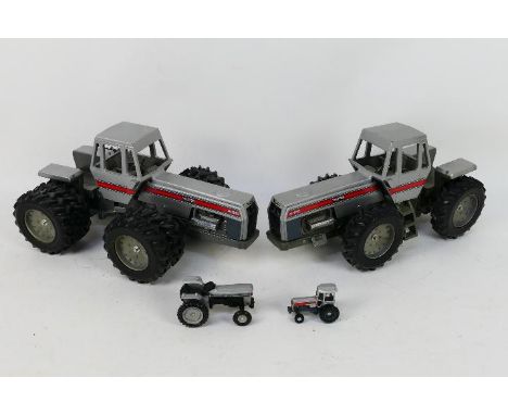 Ertl - Four diecast model White tractors in various scale. Lot consists of an Ertl 1:16 scale a White 4-210 double wheel fron