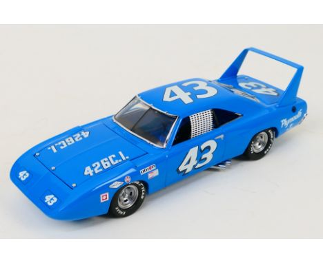 Franklin Mint - A boxed 1970 Richard Petty Plymouth Superbird in 1:24 scale. The model appears Mint in its original packaging