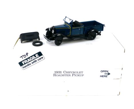 Franklin Mint - A boxed 1931 Chevrolet Roadster Pickup in 1:24 scale. The model appears Mint in its original packaging. (This