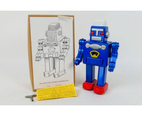  Hawkin's Bazaar Tin Toys Collectors' Club - A boxed Chinese made tin plate robot in blue colour. Robot comes with wind-up ke