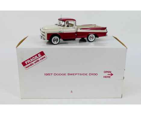 Franklin Mint - A boxed 1957 Dodge Sweptside D100 Pickup in 1:24 scale. The model appears Mint in its original packaging. (Th