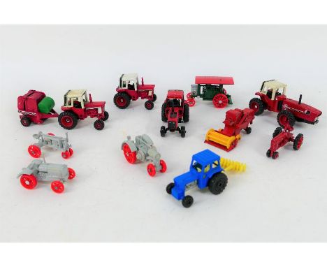 Ertl - An unboxed group of 1:64 scale diecast tractors and agricultural vehicles. Lot includes Ertl International 1086; Inter