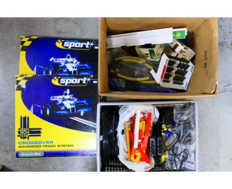 Scalextric - A mixed lot of vintage and modern Scalextric accessories and a quantity of modern track. Lot includes a Grandsta