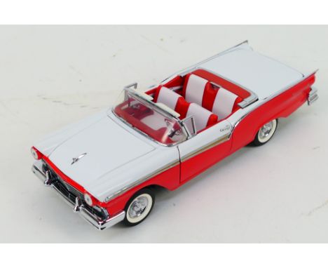 Franklin Mint - A 1957 Ford  Retractable in 1:24 scale. The model appears Mint in its original polystyrene packaging but with