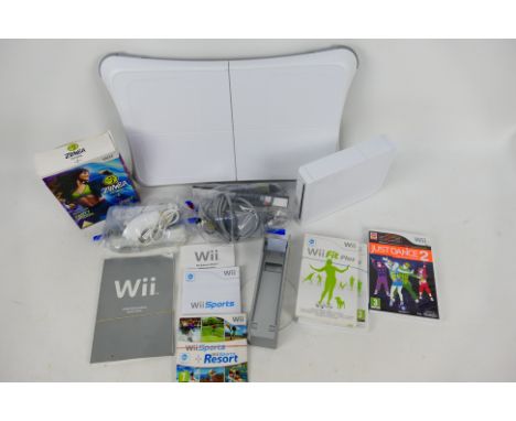 Nintendo - Wii - A Nintendo Wii console with Balance Board, two controllers, power lead, instruction books, and three discs. 