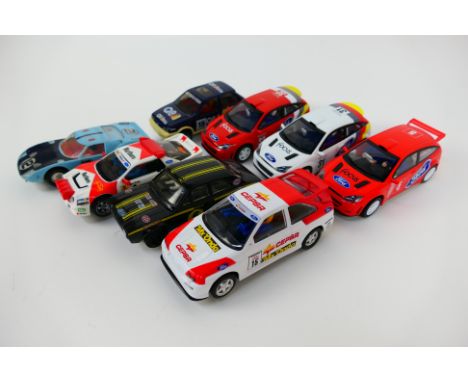Scalextric - 8 x unboxed Ford slot cars including Fiesta, Escort Mexico, GT40, Escort Cosworth and Focus. They show signs of 