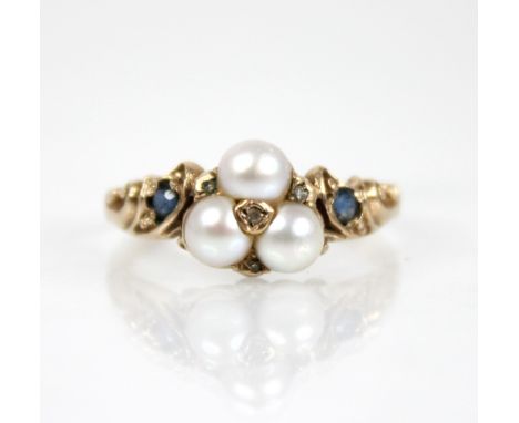 A Victorian style pearl, diamond and sapphire 9ct gold ring, the floral head comprising three mabe pearls, interspersed by sm