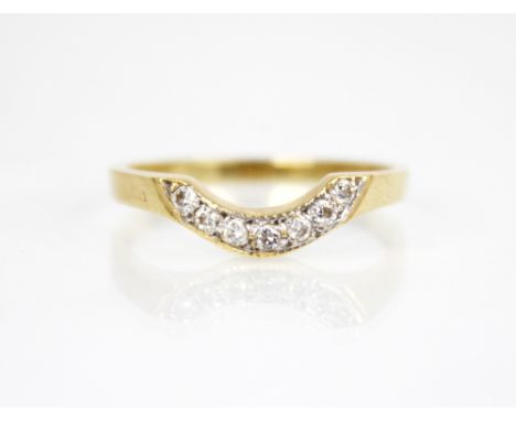 A diamond 18ct gold crescent ring, the arched head set with seven round brilliant cut diamonds, continuing to a plain polishe