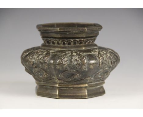 A Chinese archaic style bronze censer, 19th/20th century, of compressed octagonal form, decorated in relief to the exterior w