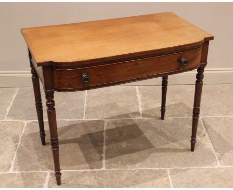 A Regency mahogany bow front side table, the shaped top above a single convex frieze drawer applied with brass button handles