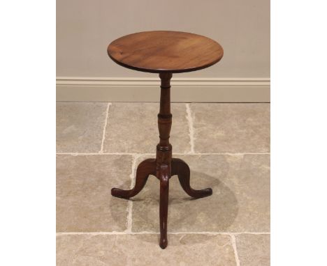 A George III mahogany tripod table, the circular top upon a ring turned baluster column extending to three cabriole legs, 72c