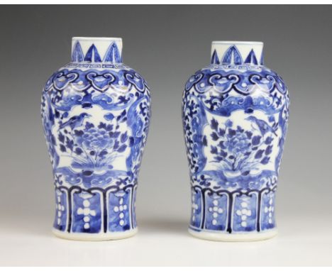 A pair of Chinese porcelain blue and white vases, 19th century, each of high shouldered form and externally decorated with re