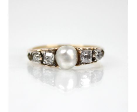 A Victorian and later pearl and diamond ring, the central pearl measuring 5.7mm x 5.5mm, with two old cushion cut diamonds to