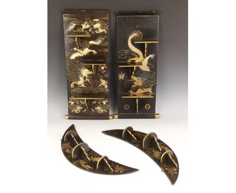 A pair of Chinese lacquered crescent wall shelves, each gilt highlighted against a black ground with figures and pagodas, eac