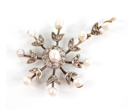 An Edwardian pearl and diamond snowflake pendant, designed as a central off-round pearl with a border surround of single cut 