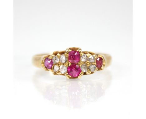 A Victorian ruby and diamond 18ct gold ring, the lozenge shaped head set with two mixed cut rubies, with four rose cut diamon