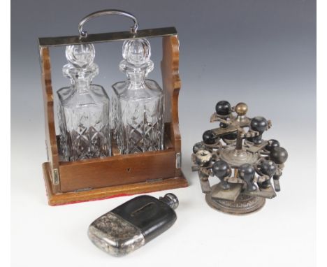 A mid-20th century tantalus, the mahogany case with EPNS mounts, stamped 'P.B &amp; S', enclosing two cut glass decanters, 35