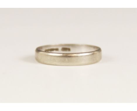 An 18ct white gold wedding band, marks for Birmingham 1979, ring size O, weight 3.4gms 