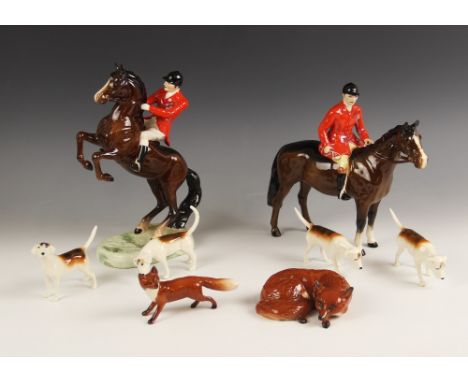 A Beswick hunting group, comprising a Beswick Huntsman on rearing horse, model no. 868, a Beswick Huntsman, design no. 1501, 