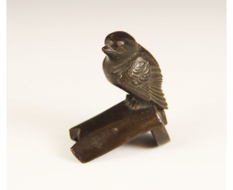 A patinated bronze model of a small garden bird, 20th century, perched on a stylised branch stand, 6cm high 