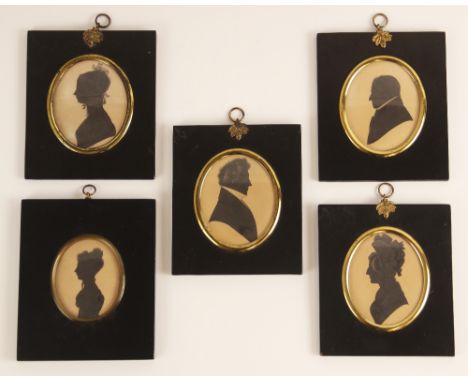 Four oval portrait silhouettes on paper, 19th century, depicting a lady wearing a ribboned bonnet, a girl wearing a lace cap,