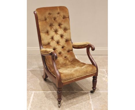 A Victorian mahogany framed and upholstered open armchair, the curved button back and seat, enclosed by padded arms raised up