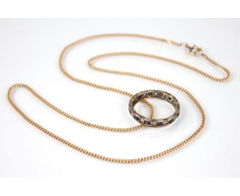 A 9ct gold curb link chain, with spring ring and loop fastening, approximately 51cm long, weight 4.3gms (at fault), together 