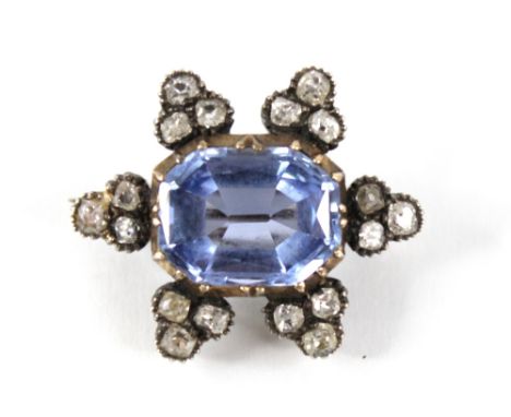 A Victorian sapphire and diamond cluster brooch, the central rectangular mixed cut sapphire with canted corners measuring 12.