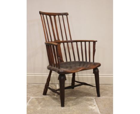 A late 18th/early 19th century primitive ash and elm comb back Windsor chair, probably Thames Valley, the stick back above an