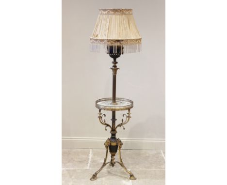 A Rococo style brass standard lamp/wine table, late 19th, early 20th century, the converted oil lamp reservoir upon a telesco