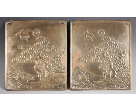 A pair of Japanese polished bronze plaques, Meiji Period (1868-1912), each of rectangular form and decorated in relief with a