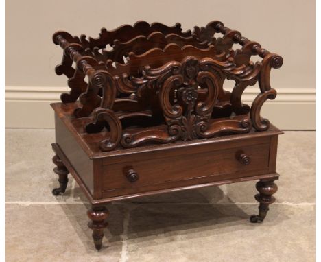 A rosewood canterbury, 19th century, the four carved scrolling openwork divisions, united by baluster turned supports, above 