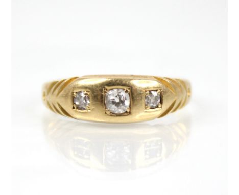 A Victorian diamond 18ct gold ring, the central old cut diamond measuring 2.7mm x 2.7mm x 1.95mm, with a further old cut diam