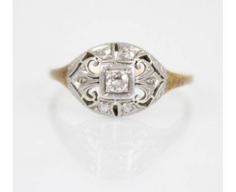 An early 20th century diamond ring, the central old cut diamond measuring 2.8mm x 2.8mm x 1.7mm, set to a pierced navette sha