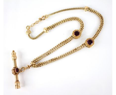 A French 18ct gold garnet set watch key on chain, the double curb-link chain with garnet set bead sliders, spring ring and lo