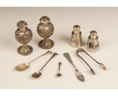 A pair of East-Asian silver coloured pepperettes, each of globular form on raised circular foot with pierced floral covers, e