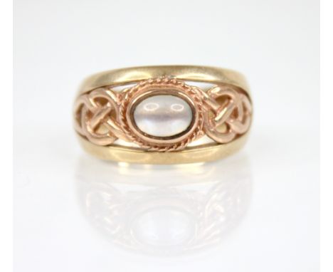 A Clogau moonstone 9ct gold ring, the central oval moonstone cabochon measuring 6mm x 4.5mm, set in rose gold to a rope twist