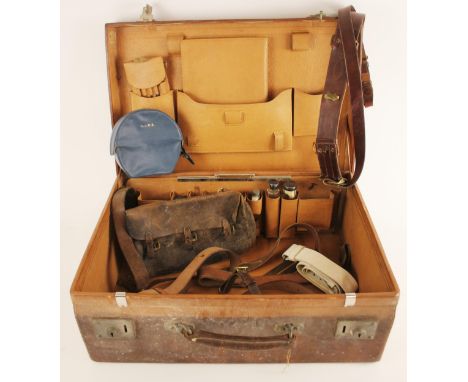 A gentleman's leather suitcase with fitted interior, early 20th century, impressed initials 'R.B' to the top, opening to a fi