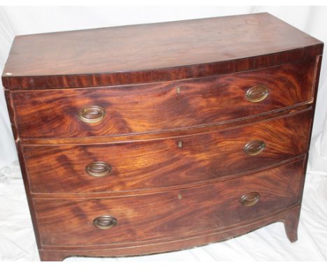 A 19th century mahogany bow front chest of three long graduated drawers with brass ring handles on bracket feet, 41" long