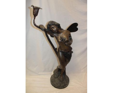 A large 20th century bronze figure of a nude winged female reclining on an entwined candle sconce on circular base, 45½" high