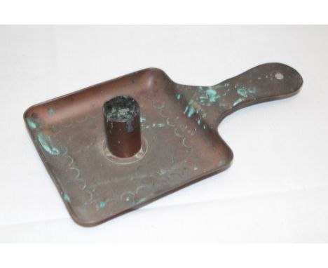 A Newlyn copper chamber candlestick with incised decoration marked "Newlyn", 9" long