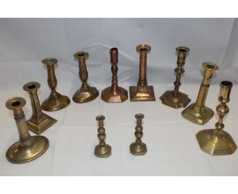 A selection of 18th and 19th century brass candlesticks including campaign-style candlestick on square base marked "H", 5½" h