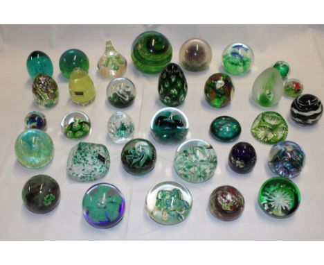 A collection of 32 various glass paperweights including Caithness, Selkirk, Langham, Wedgwood and others etc.