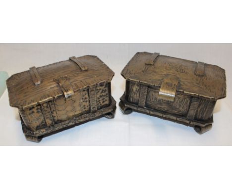 A pair of unusual bronze rectangular table boxes with hinged lids on scroll feet, 6½" long